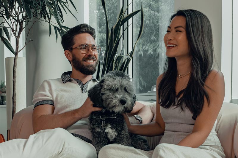 Couple with Dog on Couch Showing Live